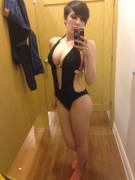 Short-Haired Brunette Trying On A Swimsuit