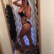 Showing Off In Her Black Bikini