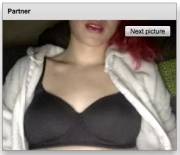 There's A Black Bra Beneath The White Onesie, But What's Beneath The Black Bra?