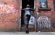 In My High-Heeled Ankle Boots And Leather-Look Catsuit For A Day In Manchester.