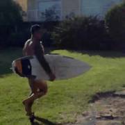 A Hot Naked Man, With A Surfboard Under One Arm, A Bottle Under The Other, Running ...