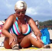 Tan Blonde With Short Hair Needs Help Putting On Lotion