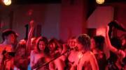 Topless Singer And Topless Audience Members.