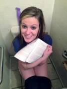 Showing Us Her Reading Material