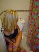 Blonde Caught Mid-Wipe