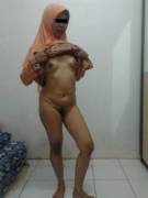 Muslima In A Peach Jilbab Bares Herself [9 Images]