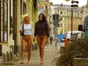 Two Ladies Enjoying A Walk In The City