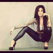 Tattood Brunette In Latex Leggings