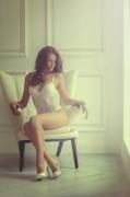 Sitting On A Chair In White Lingerie