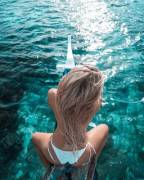 Is That The Bow Of A Boat She's Sitting On?