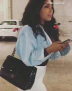 The White Pants Complement Her Goods Perfectly