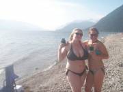 Busty Bikini Babe Enjoying A Beer By A Mountain Lake