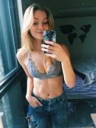 An Attractive Girl In A Bra, Taking A Photograph Of Herself