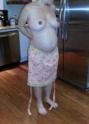 8 Months Pregnant, Wearing Just An Apron In The Kitchen