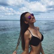 Babe At The Beach In A Black Bikini