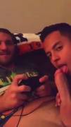 Sucking Him While He Plays His Game