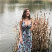 Showing Off Her Cute Smile And Subtle Cleavage