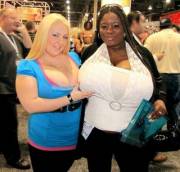 Busty Blonde Hefts One Of Mianna Thomas's Massive Tits