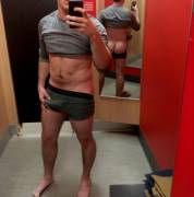 Making Sure He Fits Snugly In The Fitting Room At The Mall