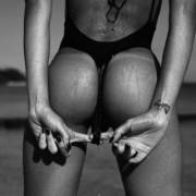 Pulling Down Her Swimsuit