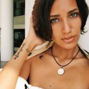 Pretty Eyes - Can Someone Translate Her Tatoo?