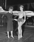 Swedish Stewardess Birgitta Lindman With The Swedish Sas Airline Examines A Showgirls ...