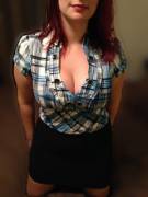 Here She Is Kneeling On The Bed In A Tight Top And A Skirt