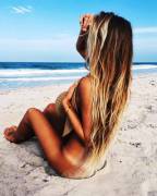 Using Her Hat To Cover Up