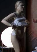 She Pulls On A Cami That Hides Nothing