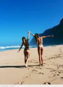 Two Girls Frolicking On Beach
