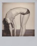 Bent Over With Polaroid Camera