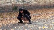 Dark Haired Babe Stops In The Middle Of A Road To Piss Outside