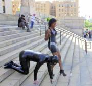 Woman Walking Her Slave