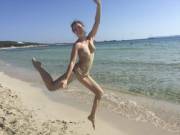 Jumping For Joy While Covered In Sand
