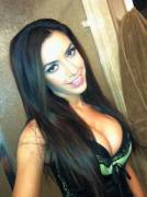 Busty Girl In A Green Trimmed Top.