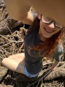 A Girl On A Wood Pile