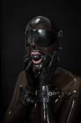 Collared, Gagged And Hooded In Transparent Rubber