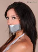 Sarah Brown - Post Tied In A Shiny Swimsuit