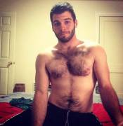 His Tank Top Shows Off His Best Asset ;)