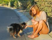 Playing With Her Puppy While Showing Off Her Pussy