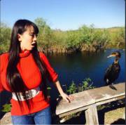 Hitomi Tanaka In A Red Sweater While Visiting South Florida For A Photo Shoot.