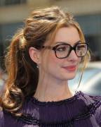 Anne Hathaway With Glasses And A Loose, Messy Ponytail