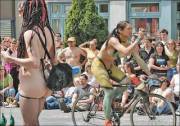 Body Paint Ridding Bicycle In The Middle Of The Street